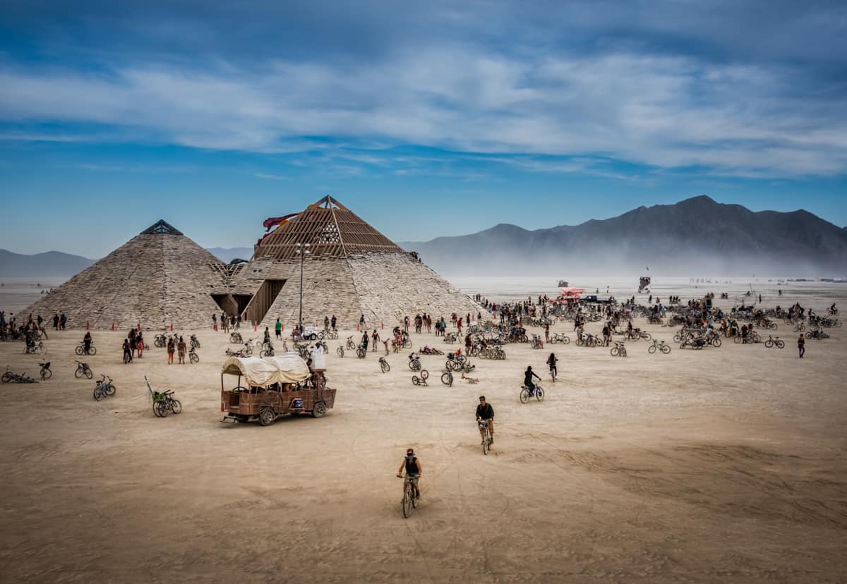 Pyramids with people on bicycles